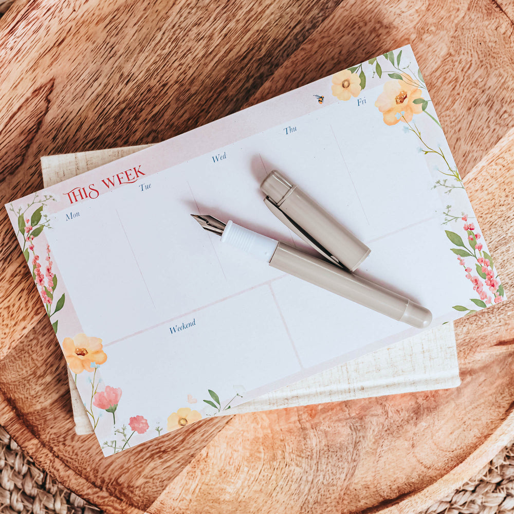 
                      
                        Wild Blossom Weekly Planner Notepad
                      
                    
